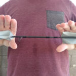 Use duct tape to pull apart a stuck fishing rod.